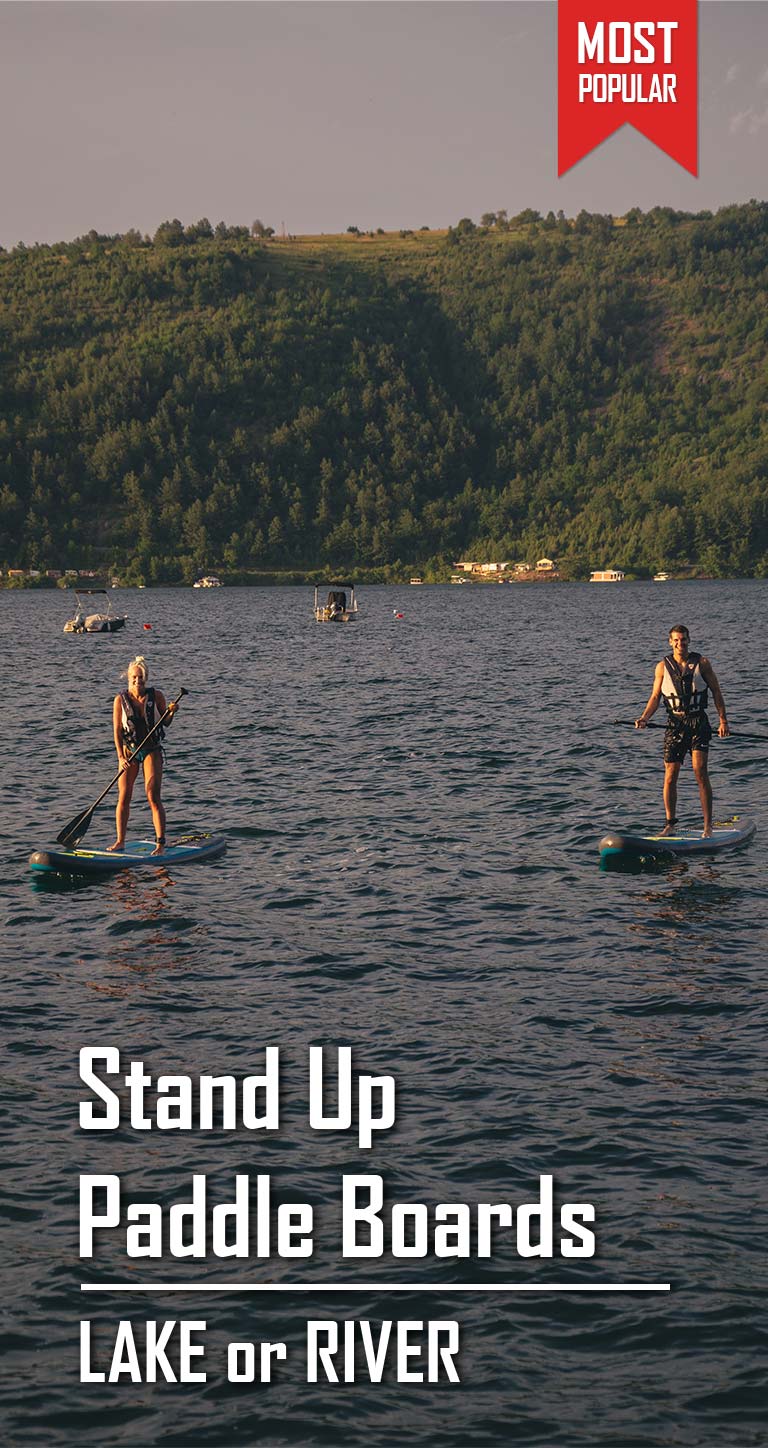 The girl is paddleboarding on the lake